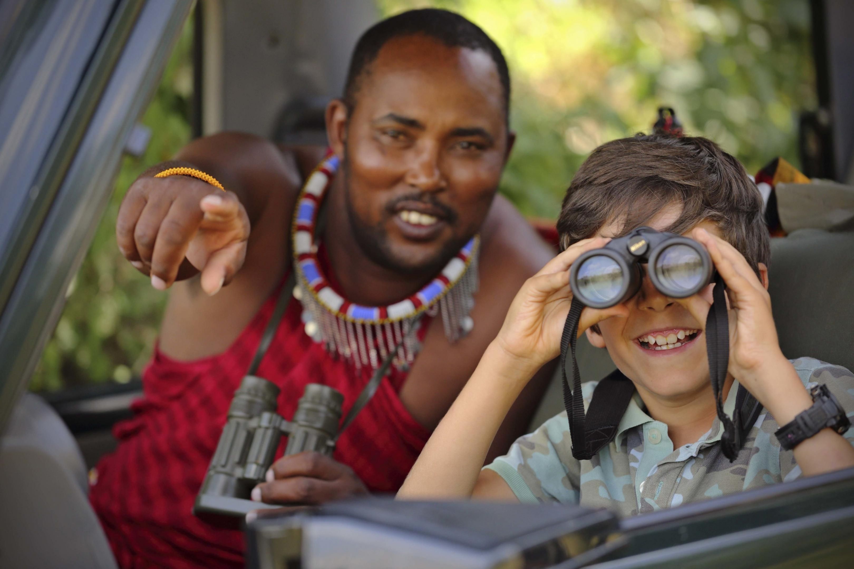 Family on a game drive in Kenya, a must for family safari