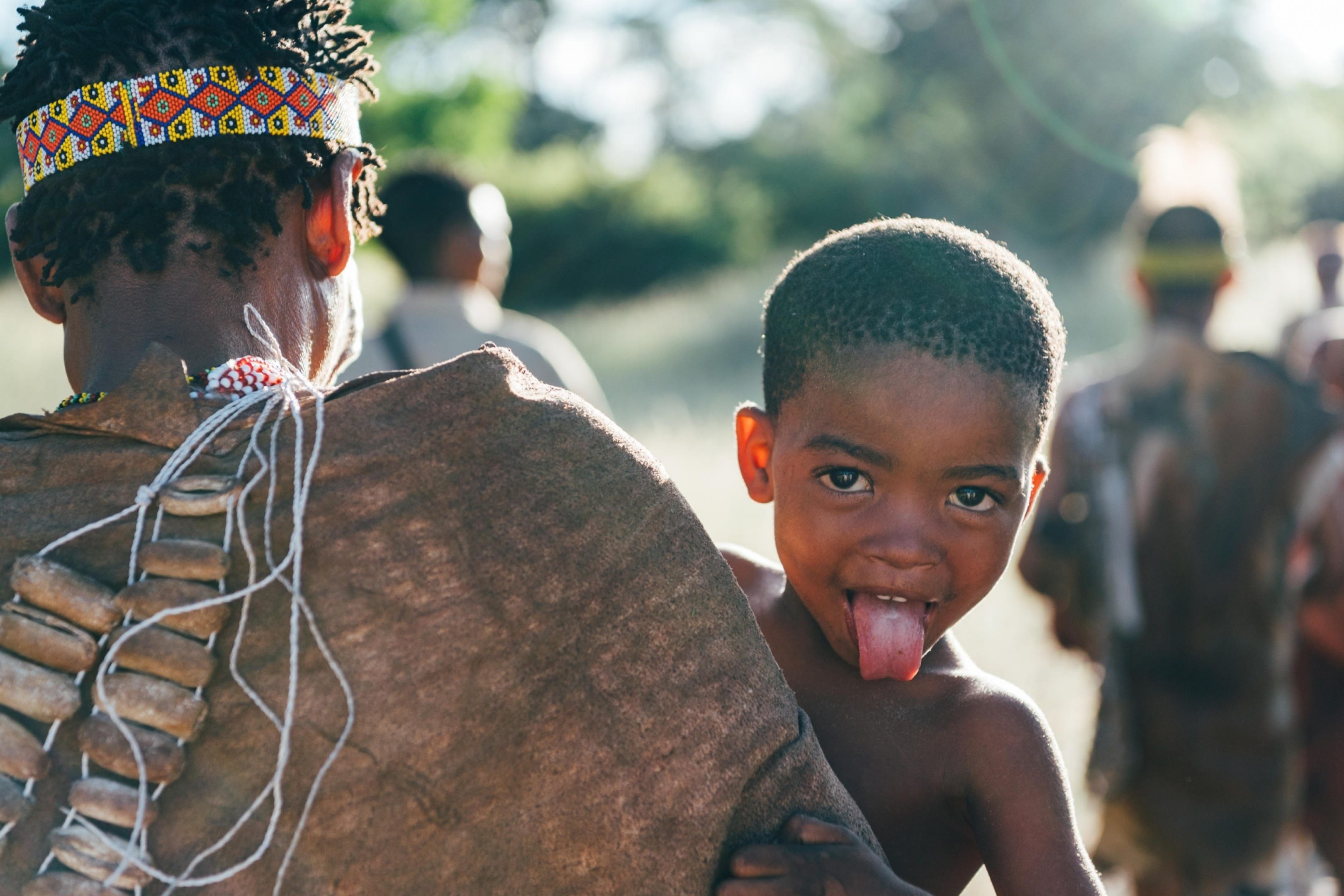 Family engaging with Bushmen, cultural highlight of a family African safari