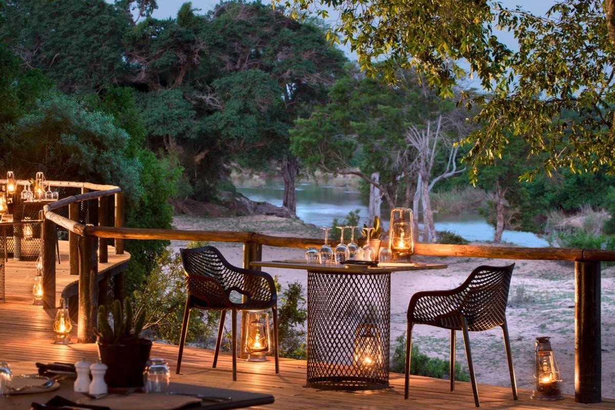 Elegant outdoor dining setup at a luxury safari lodge in South Africa